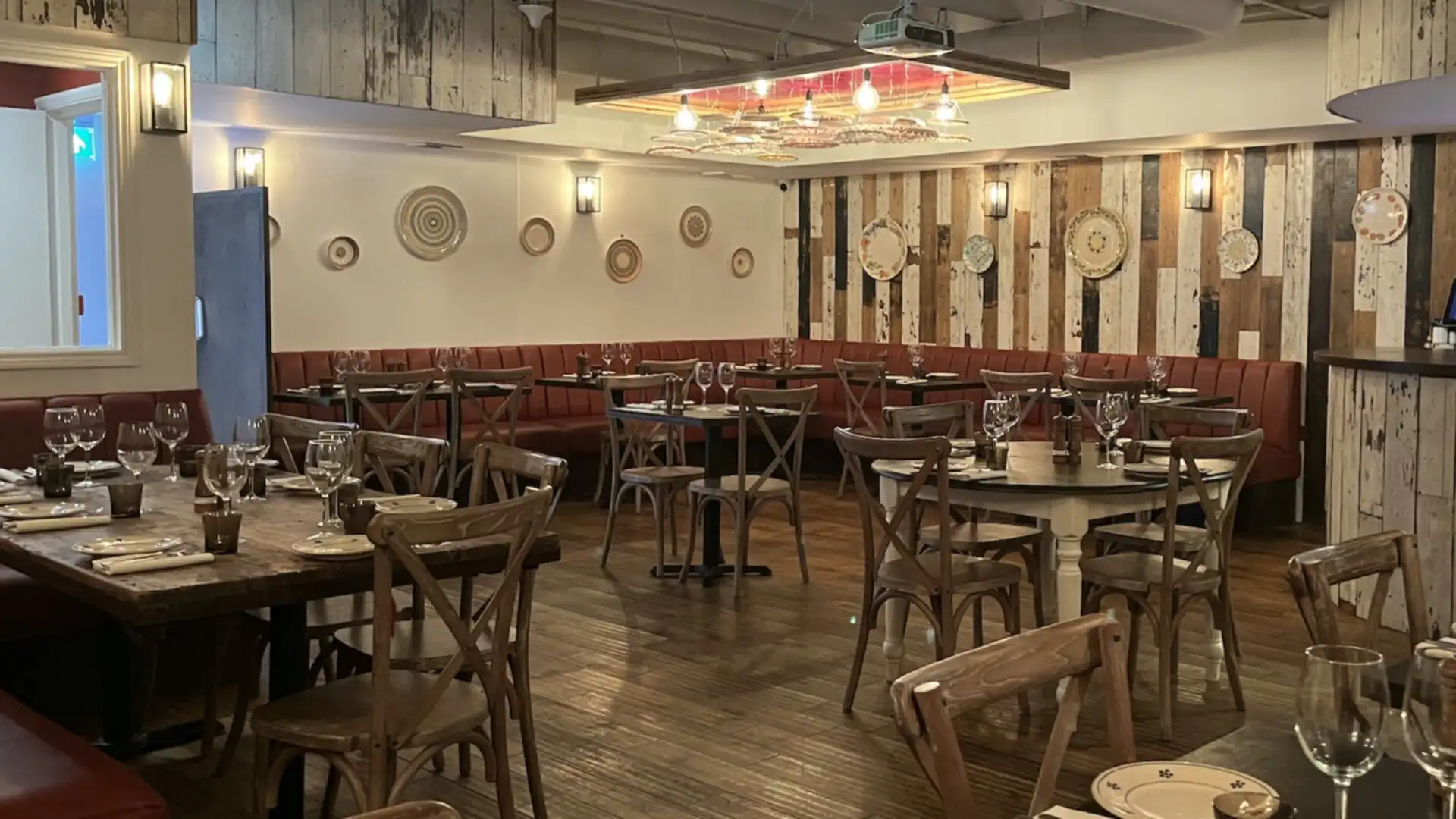 A full view of the space with multiple tables and Italian designed furniture
